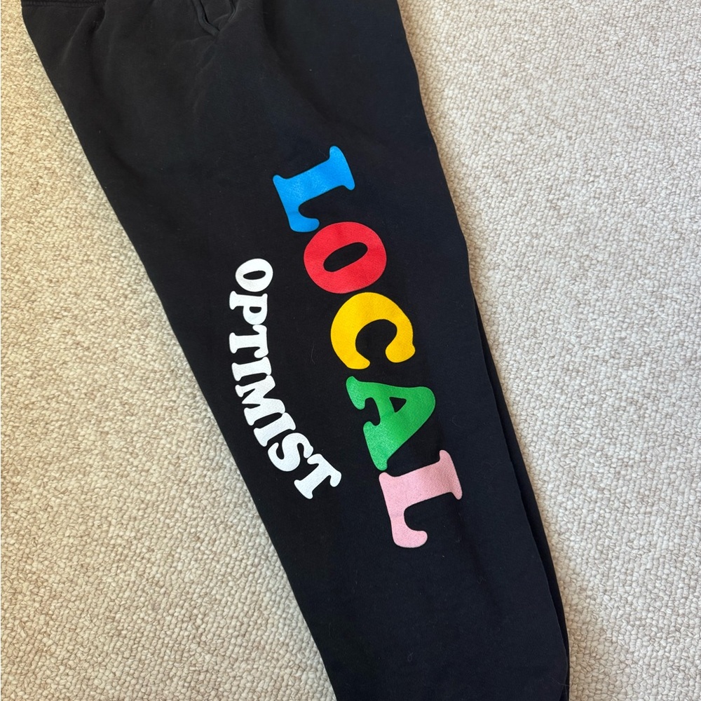 Madhappy Black Track Pants with Colorful Local Optimist Design